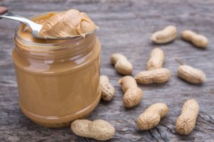 jar of peanut butter with nuts