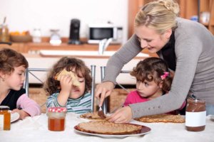 nutella - mother preparing breakfast for kids